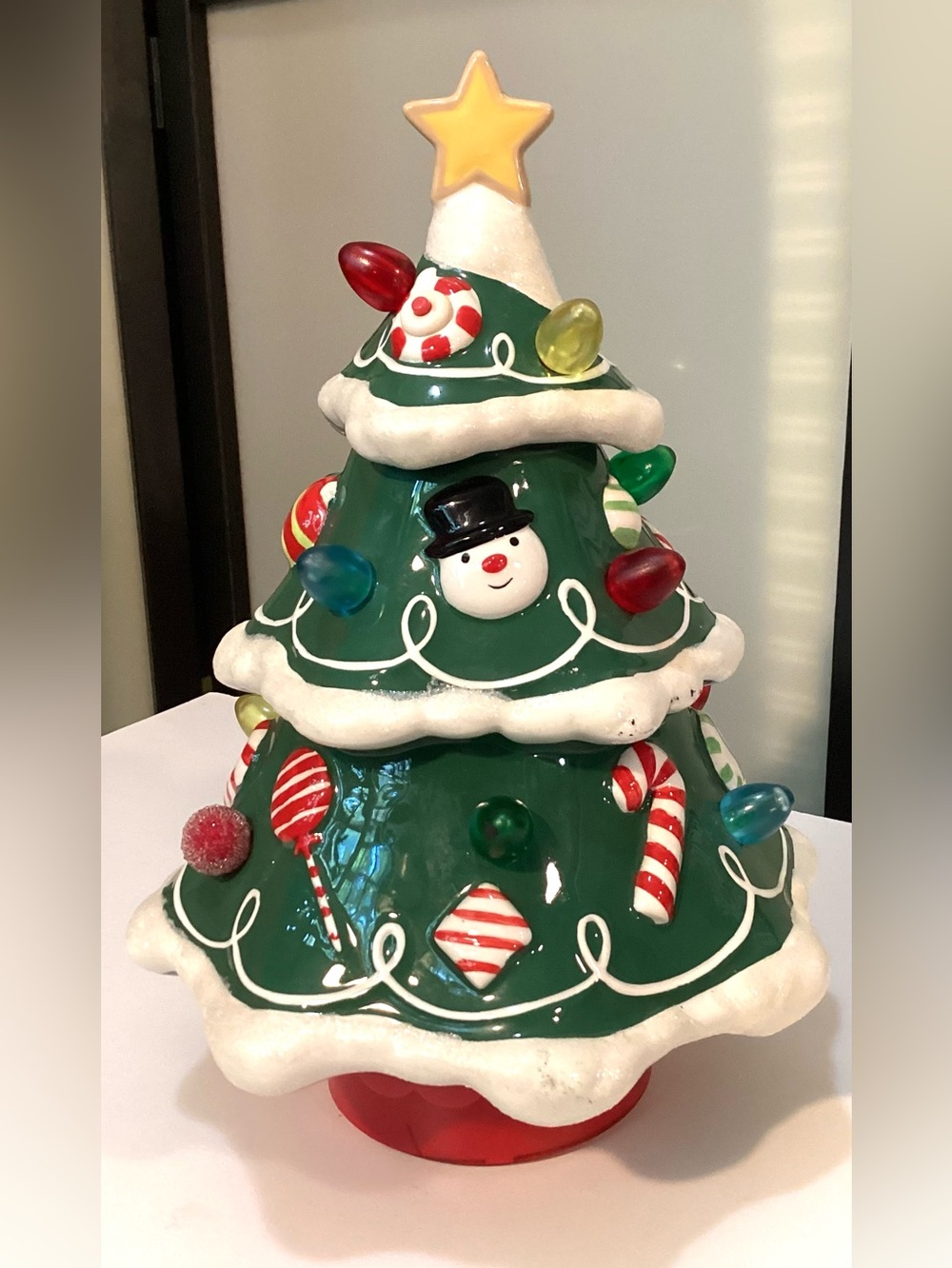 Ceramic decorative Christmas tree with candies.
